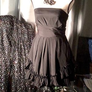 BCBGeneration size 2 black mini dress with ruffle on bottom.  Cute back